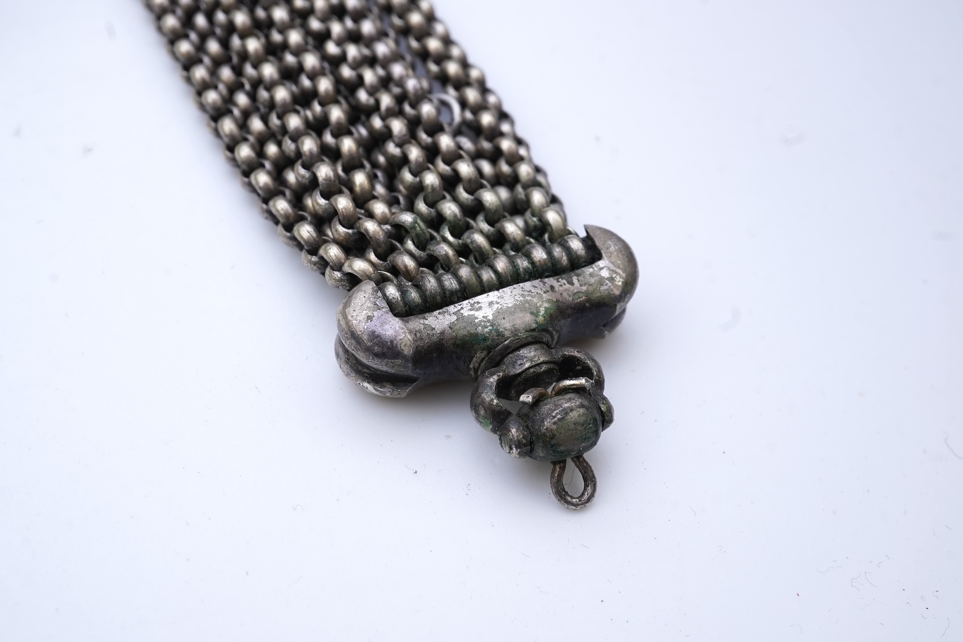 A chatelaine and a pair of serpentine bead earrings